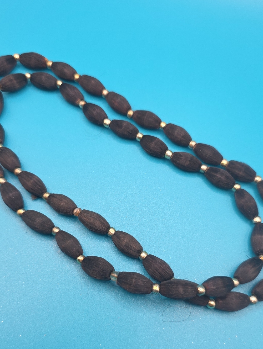 Handcrafted Dark Brown Wood Bead Necklace with Gold Accents